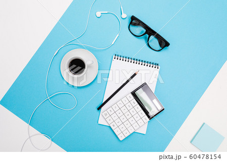 School and office supplies lie neatly on a white and blue background 60478154