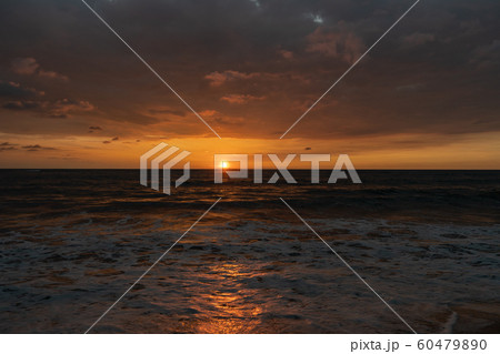 Beautiful sunset on the shore of the Indian Ocean Beautiful sunset on the shore of the Indian Ocean 60479890
