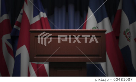 Flags of the Dominican Republic and the United Kingdom at international meeting, 3D rendering 60481007