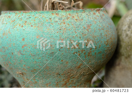 Old cast iron jug, standing in the yard for Old cast iron jug, standing in the yard for 60481723