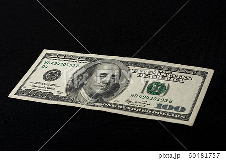 One hundred american dollars lie on a black One hundred american dollars lie on a black 60481757