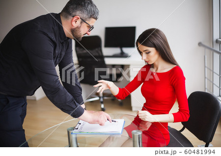Business. Business Woman Gives Money to Men. Woman Dressed in Red Dress Gives Bribe. Business Man In Gray Jacket Gets Bribe. High Resolution Business. Business Woman Gives Money to Men. Woman Dressed in Red Dress Gives Bribe. Business Man In Gray Jacket Gets Bribe. High Resolution 60481994