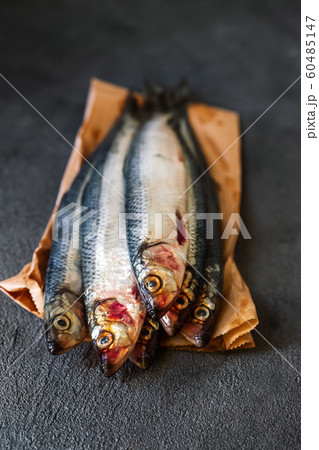 Raw herring fish on a dark background 60485147