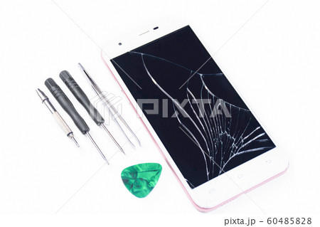 Cell phone with a broken screen on a white 60485828