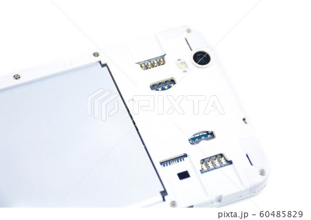 A cell phone with an open cover lies face down on 60485829