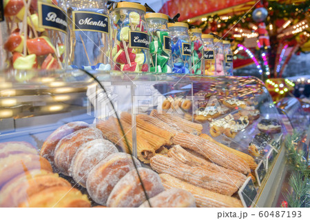 Lollipop donuts and cakes on a counter at the christmas market 60487193