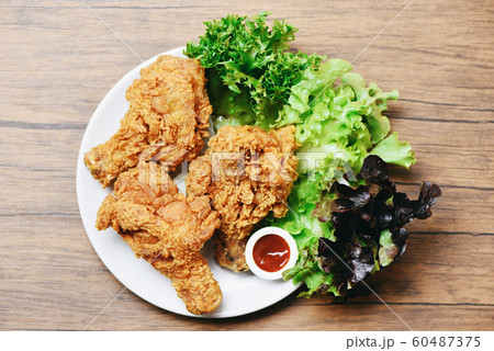 Fried chicken crispy on white plate with ketchup 60487375