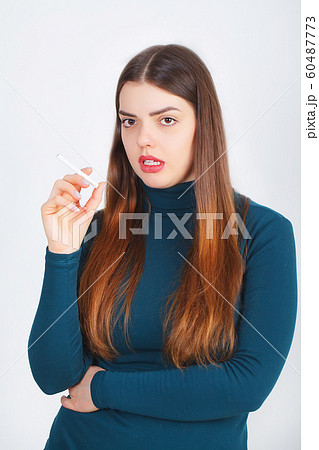 Woman with broken cigarette - stop smoking concept 60487773