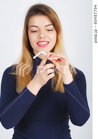 Stop Smoking. Beautiful Woman Breaking Cigarette In Half 60487794