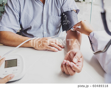The doctor evaluates the patient with a stethoscope and records the results 60489318