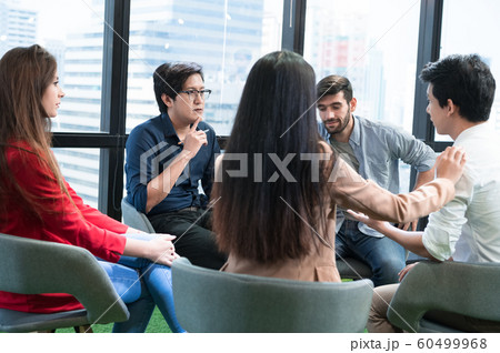 Psychotherapist inquiring about symptoms occurring 60499968