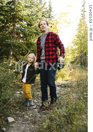 Father and son in forest Father and son in forest 60500435