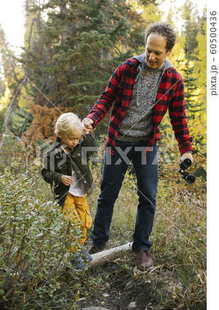 Father and son in forest Father and son in forest 60500436