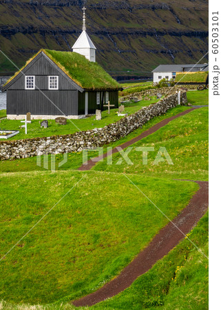 Church with grass on the roof and path in the grass 60503101