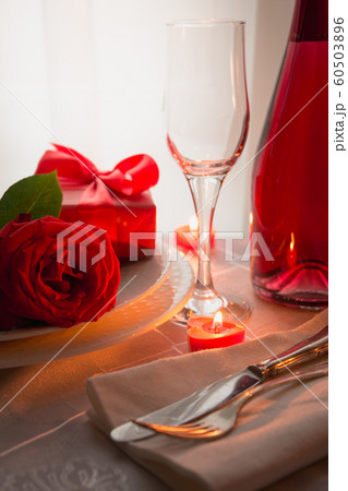 Festive or romantic dinner with red rose and champagne. Valentine day. 60503896