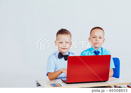 study on the computer two boys at school 60508655