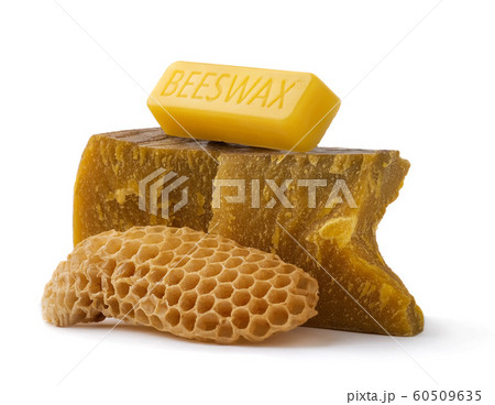 How to get natural organic beeswax. Pieces of organic beeswax on a white background. The use of beeswax in apitherapy. Production Ingredient for Medical and Cosmetics. 60509635