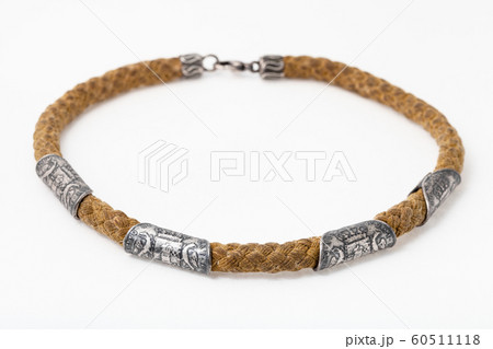 cotton rope with ancient silver coins on white cotton rope with ancient silver coins on white 60511118