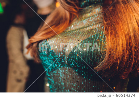 Decollete, female breast. Neckline green dress and fur collar. Decollete, female breast. Neckline green dress and fur collar. 60514274