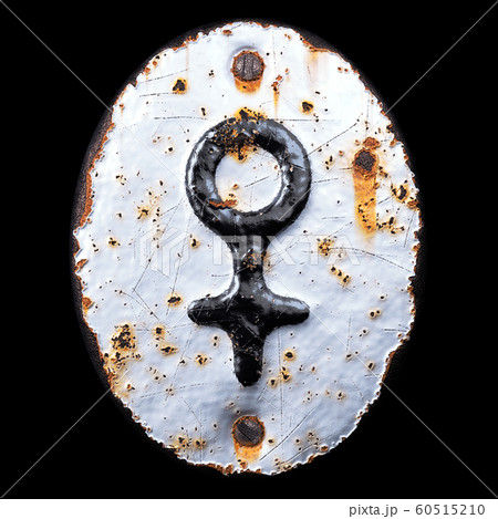 Symbol female made of forged metal on the background fragment of a metal surface with cracked rust. 60515210