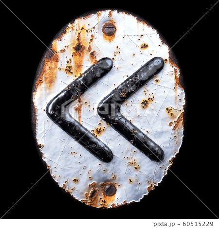 Symbol left pointing double angle quotation mark made of forged metal on the background fragment of a metal surface with cracked rust. 60515229