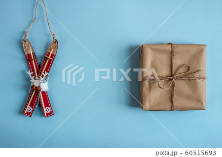 wooden toy ski and wrapped gift blue background wooden toy ski and wrapped gift blue background 60515693