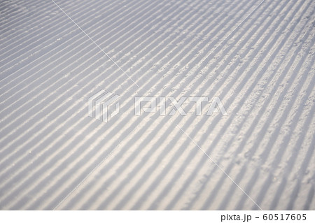 perfectly groomed empty ski run on a sunny winter day perfectly groomed empty ski run on a sunny winter day 60517605