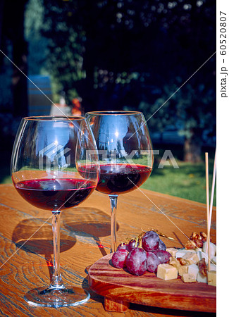 Glasses Of Fine Red Wine With Grape and Cheese Glasses Of Fine Red Wine With Grape and Cheese 60520807
