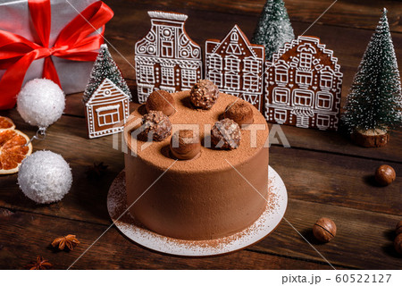 Christmas holiday table with delicious truffle cake Christmas holiday table with delicious truffle cake 60522127
