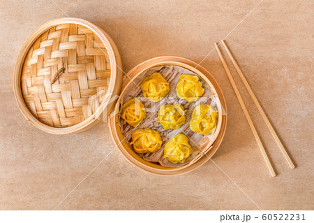 Traditional dumplings Manti steamed in wooden pot. 60522231