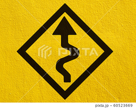 a black arrow points painted on a stucco wall 60523669