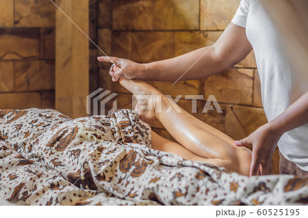 Total relaxation. Beautiful Young Wwoman Get Balinese or Thai Massage Total relaxation. Beautiful Young Wwoman Get Balinese or Thai Massage 60525195