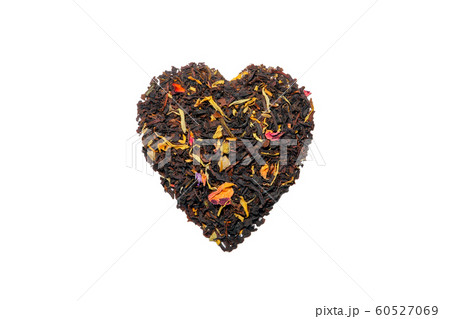 black tea heart shape with fruit pieces and flower petals macroisolate 60527069
