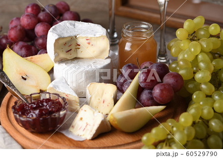 Antipasti. Cheese camembert with fruit and wine 60529790
