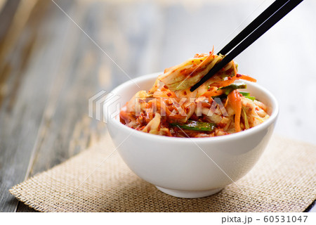 Kimchi cabbage in a bowl with chopsticks, Korean food Kimchi cabbage in a bowl with chopsticks, Korean food 60531047