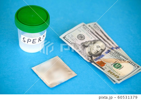 Health. Close up Concept of Bank Sperm. Infertility Bank with Sperm. Sperm Analysis on Blue Background 60531379