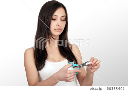 Healthy Young Woman Refusing To Take Cigarette From Pack. Portrait Of Beautiful Female Showing Stop Sign With Hand To Cigarettes. Quit Smoking Concept. High Resolution Healthy Young Woman Refusing To Take Cigarette From Pack. Portrait Of Beautiful Female Showing Stop Sign With Hand To Cigarettes. Quit Smoking Concept. High Resolution 60533401
