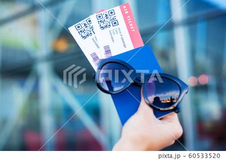 Close up two air ticket in abroad passport near airport Close up two air ticket in abroad passport near airport 60533520