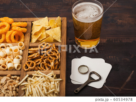 Glass of craft lager beer and opener with box of 60534978