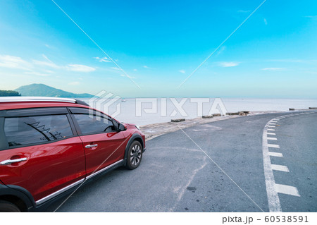 Modern new red SUV car on the road  60538591