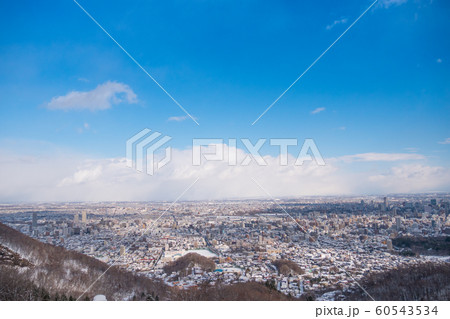 Top view of snow capped city and blue sky Top view of snow capped city and blue sky 60543534