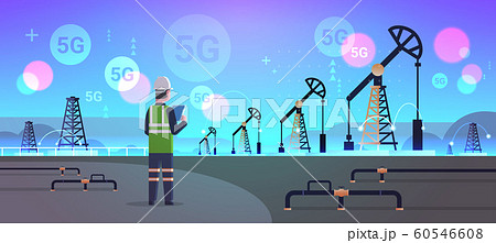 engineer refinery worker using tablet 5G online wireless system connection oil pump rig energy industrial zone oil drilling fossil fuels production concept horizontal full length 60546608