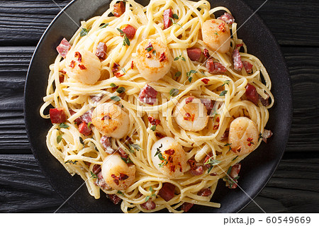Mediterranean pasta with fried scallops, bacon in Mediterranean pasta with fried scallops, bacon in 60549669