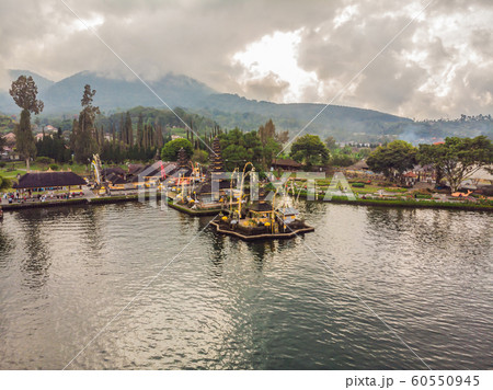 Photo from the drone. Aerial view of Pura Ulun Danu Bratan, Bali. Hindu temple surrounded by flowers on Bratan lake, Bali. Major Shivaite water temple in Bali, Indonesia. Hindu temple Photo from the drone. Aerial view of Pura Ulun Danu Bratan, Bali. Hindu temple surrounded by flowers on Bratan lake, Bali. Major Shivaite water temple in Bali, Indonesia. Hindu temple 60550945