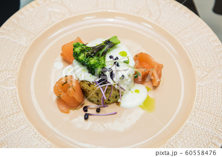 Potato casserole with broccoli and salmon 60558476