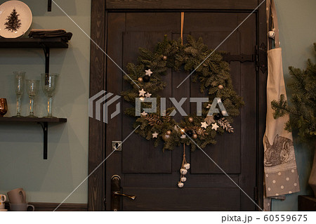 Christmas wreath on the front door. Christmas and 60559675