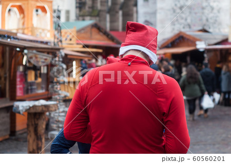 man walking with christmas hat 60560201
