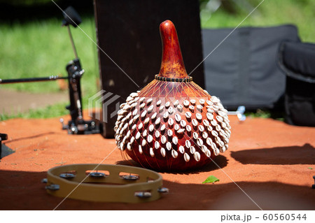 SHekere authentic african instrument outdoor shaker at day 60560544