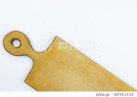 half of wooden cutting board on white background 60561338
