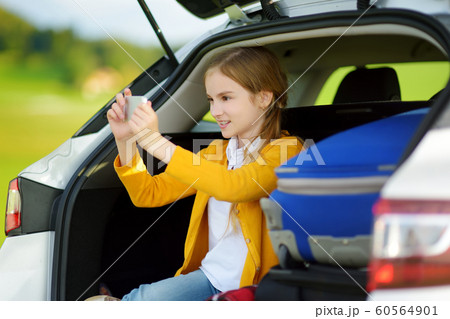 Adorable little girl ready to go on vacations with Adorable little girl ready to go on vacations with 60564901